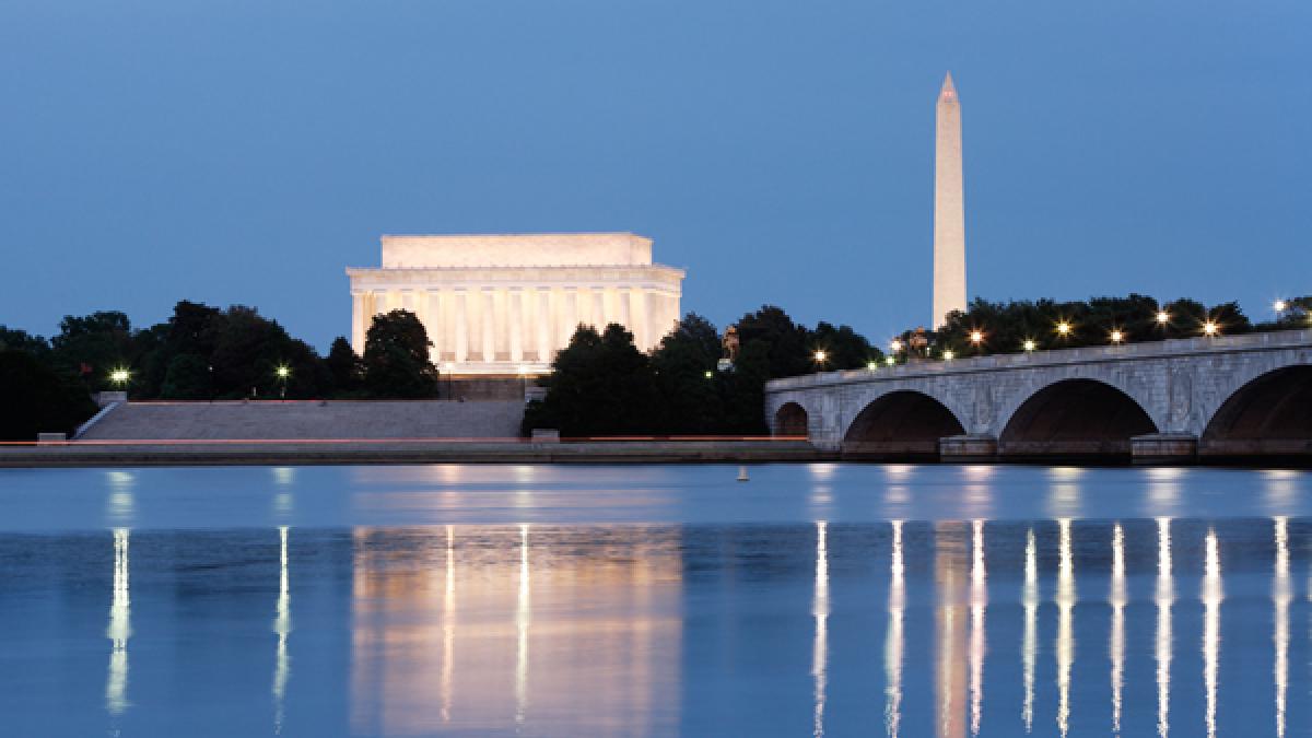 Monuments and Potomac River at night