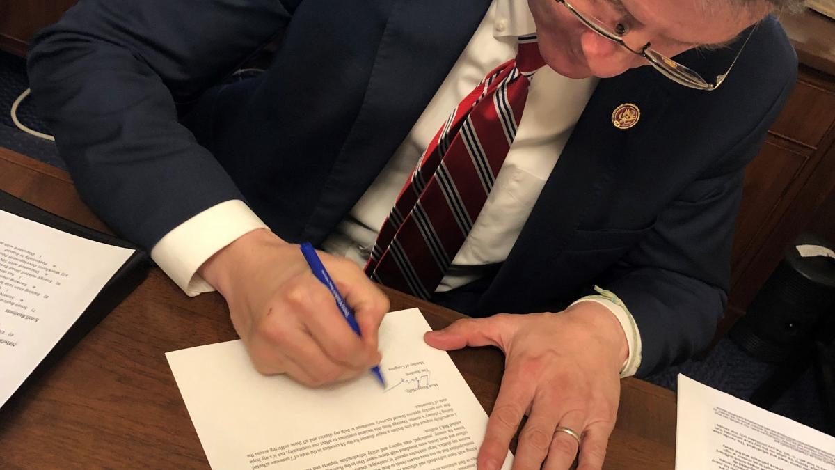 Congressman Burchett signing President disaster relief FEMA letter