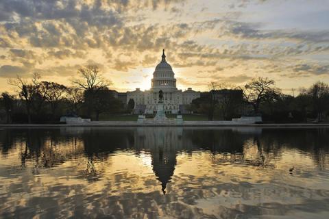 US Capitol Building with sunrise sky