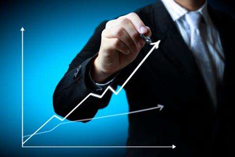 Business man hand drawing a graph